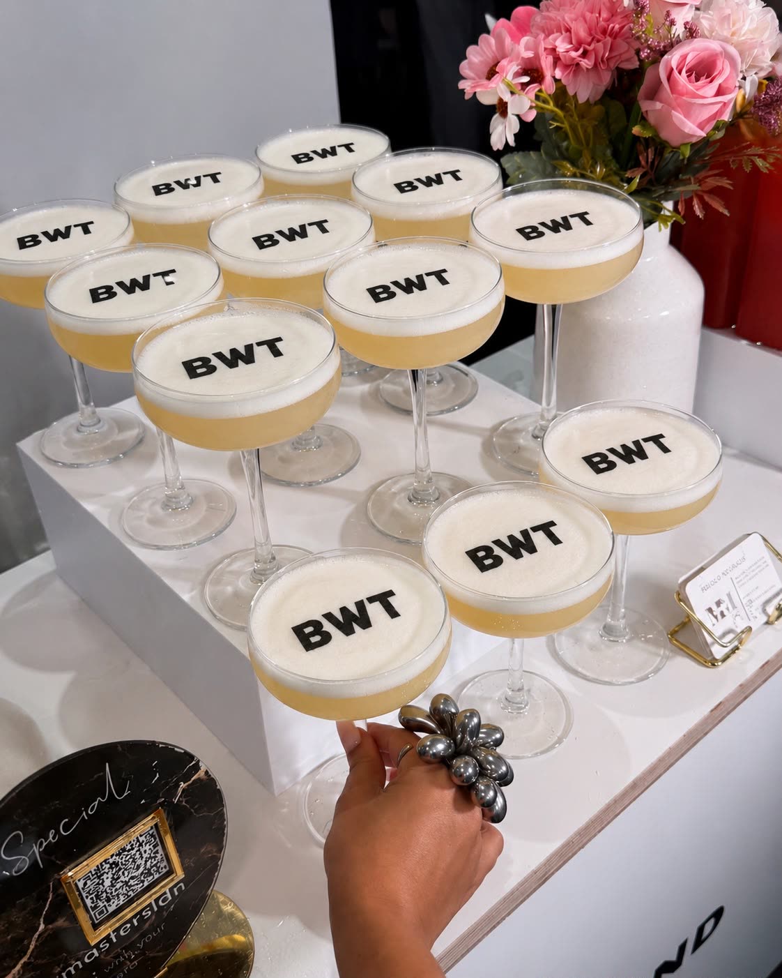 Babes Who Trade members toasting with branded coupes at a community celebration