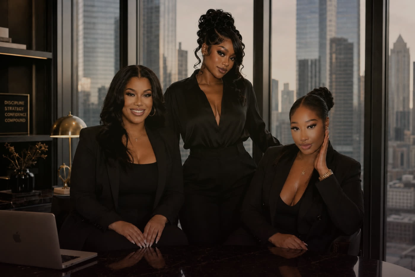 The women behind Babes Who Trade, together in a city-view office